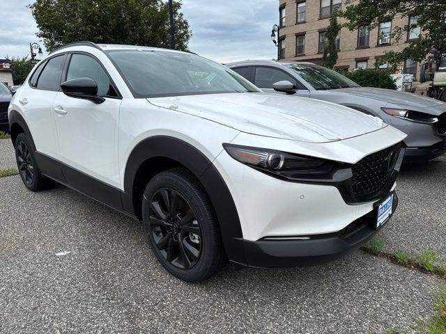 2026 Mazda Mazda CX-30 2.5 Turbo Premium Plus AWD in Snowflake White Pearl — front three-quarter view