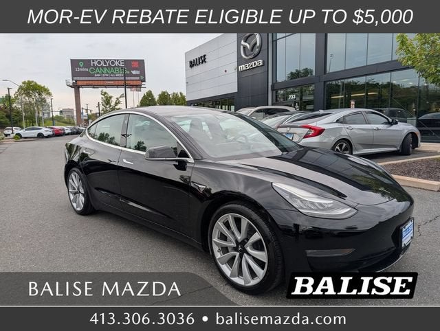 2019 Tesla Model 3 Standard Range Plus in Solid Black — front three-quarter view