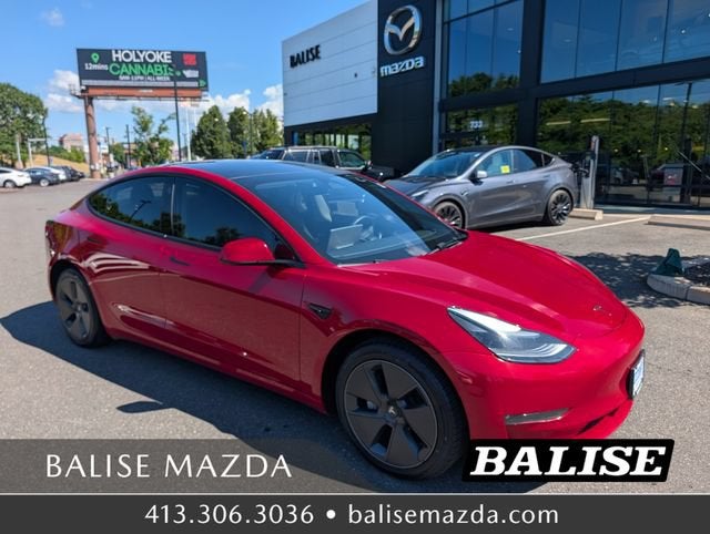 2023 Tesla Model 3 Long Range in Red Multi-Coat — front three-quarter view