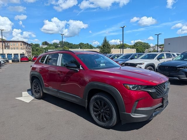 2026 Mazda Mazda CX-50 Hybrid Premium AWD in Soul Red Crystal Metallic — front three-quarter view