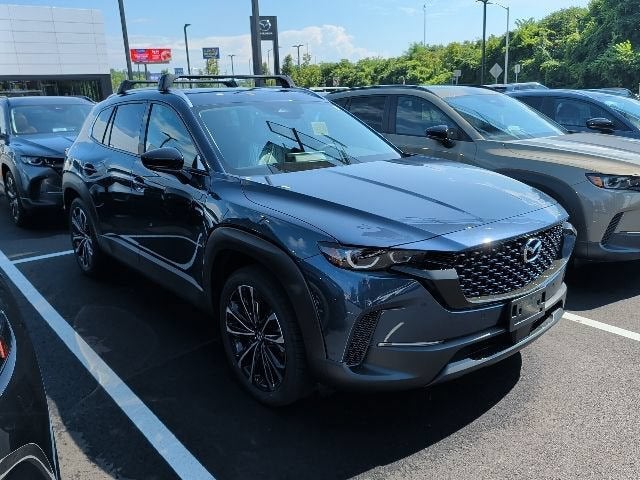 2026 Mazda Mazda CX-50 2.5 S Premium AWD in Ingot Blue Metallic — front three-quarter view