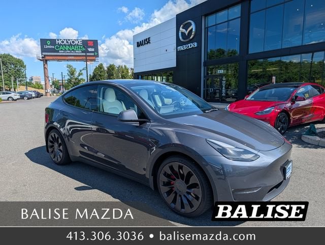 2022 Tesla Model Y Performance in Midnight Silver Metallic — front three-quarter view