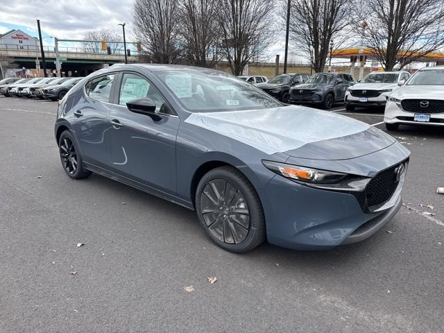 2026 Mazda Mazda3 Hatchback 2.5 S Carbon Edition AWD in Polymetal Gray Metallic — front three-quarter view